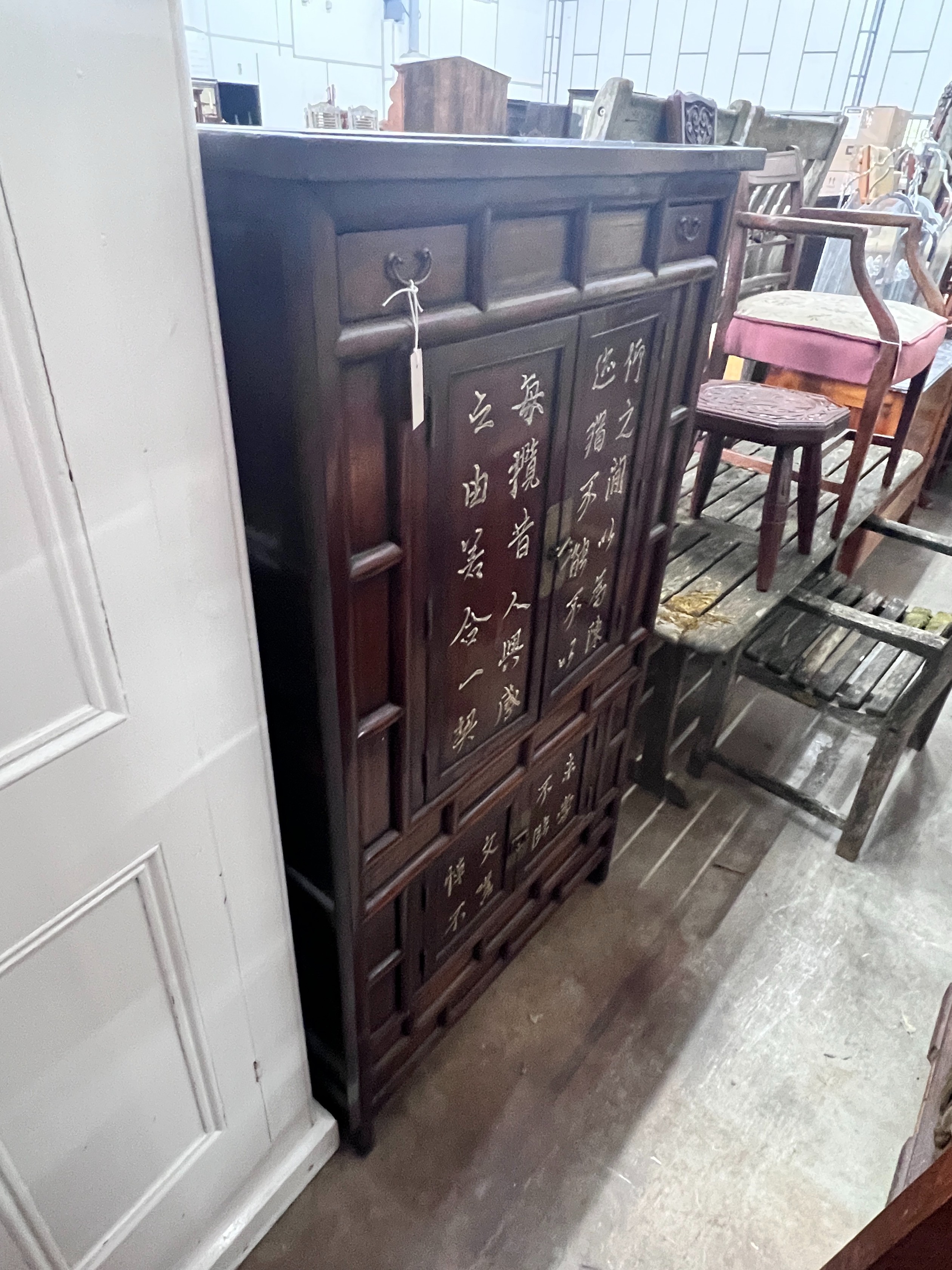 A Chinese elm cabinet, width 88cm, height 155cm *Please note the sale commences at 9am.
